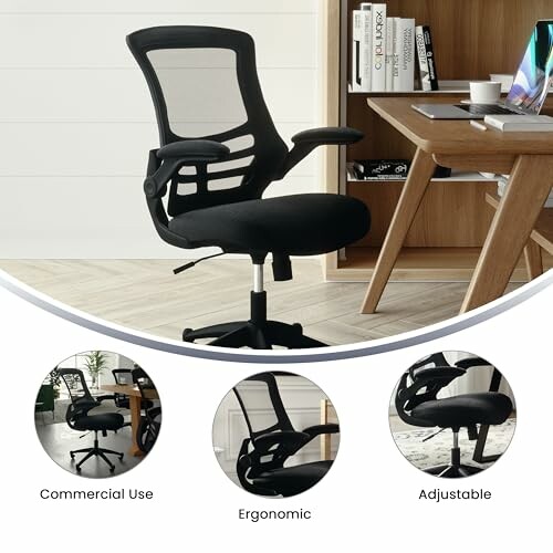 Black ergonomic office chair near desk with laptop